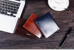 Business style short men's wallets with wood grain texture in three colors on desk