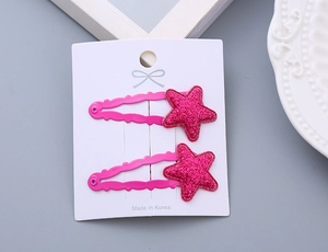 Detail of pink glitter star hair clips for girls set of two on white card