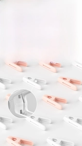 Detail of windproof plastic clothespins with thick metal springs and strong grip