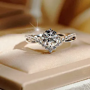 Elegant white gold crown ring with a round center diamond and shimmering pavé band