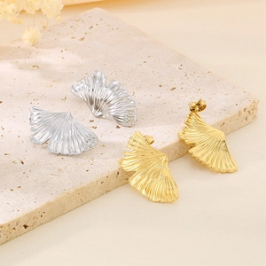Ginkgo leaf earrings in gold and silver finish with brushed metal texture