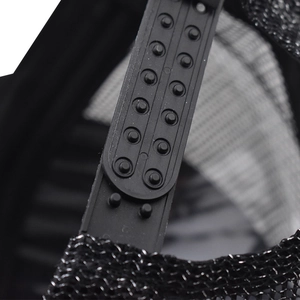 Detail of adjustable double-row plastic strap and breathable mesh on black trucker hat
