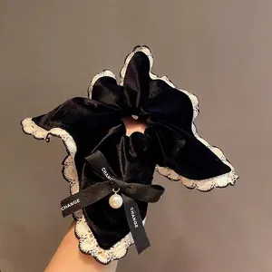 Elegant velvet hair scrunchie with lace trim, ribbon bow and pearl pendant accessory