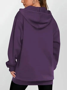 Back view of a deep purple oversized longline zip-up hoodie with a comfortable hood
