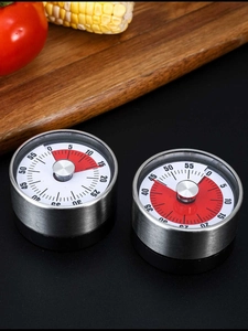 Mechanical stainless steel kitchen timers with 60-minute red visual countdown on wooden board