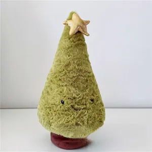 Detail of plush green Christmas tree doll with golden star and soft velvet texture