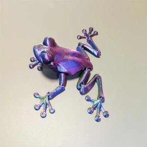 Detail of 3D printed articulated frog toy with rainbow gradient metallic finish