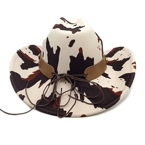 Western cowboy hat with cow print pattern and brown leather band detail