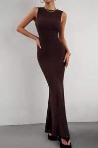 Slim fit sleeveless dark brown knit maxi dress with elegant ribbed texture on model