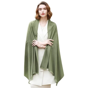 Elegant green cashmere-like shawl scarf with tassels for winter warmth and evening wear