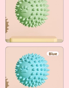 Detailed view of hollow TPR pet toy balls with paw prints and massaging tooth cleaning spikes