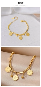 Close-up of gold coin pendants and rectangular chain link with K18 hallmark detail