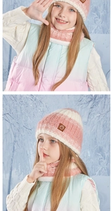 Detail of pink striped kids knit hat and scarf set with leather logo patch in snow forest