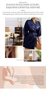Detail of luxury navy silk bathrobe with elegant kimono tie waist and tassel fringe accents