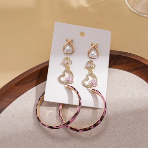 6-piece earring set featuring pink leopard print hoops, pearl studs, and rhinestone hearts