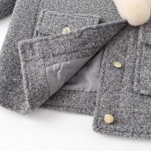 Grey textured wool jacket with gold metal buttons and white plush trim details