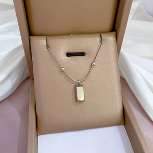 Silver beaded titanium steel necklace with a rectangular pendant in a brown gift box