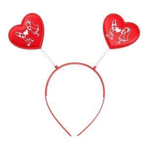Detail of red Valentine headband featuring spring-mounted hearts with white couple patterns