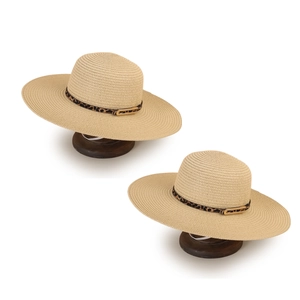 Beige wide brim straw sun hat with leopard print band and gold buckle on wooden stand