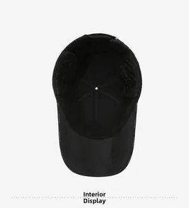 Interior view of black quilted baseball cap showing reinforced seams and ear flaps