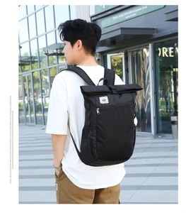 Classic black roll-top backpack featuring a waterproof design and front zipper pocket