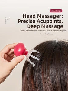 Detail view of manual scalp massager claws pressing on hair for deep pressure relief