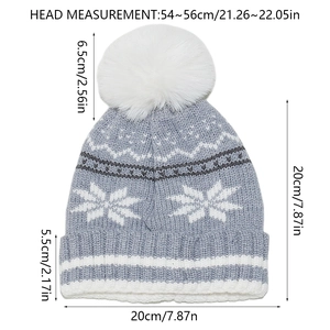 Detailed size chart of kids' blue winter knit beanie with snowflake pattern and white pompom