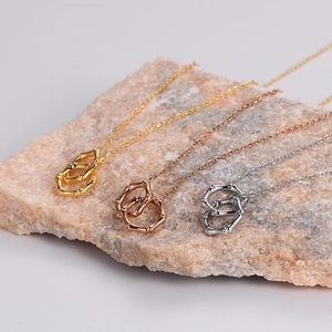 Bamboo style interlocking double circle necklace set in gold, rose gold and silver finish