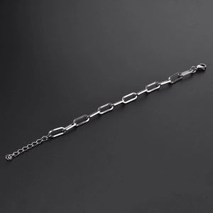 Detailed close-up of a 7mm silver stainless steel chain bracelet with a lobster clasp
