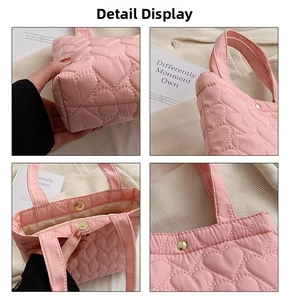 Detail of pink heart-quilted tote bag featuring magnetic closure and soft fabric lining