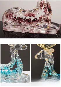 Detail of artistic resin elk statue with gold leaf inlay and purple blue crystal texture