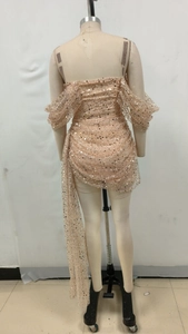 Detail of champagne gold sequin dress back with long flowing mesh ribbon drape