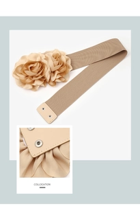 Detail of beige elastic flower belt with double floral ornaments and snap closure