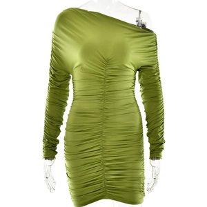 Detail view of the green off-shoulder pleated dress with slim-fit bodycon texture