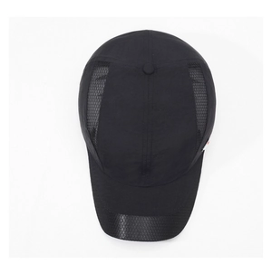 Detail of black breathable mesh side panel and quick-dry fabric on sports baseball cap