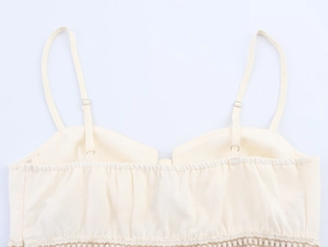 Detailed macro view of the beige cotton-linen camisole with adjustable straps and elastic frills