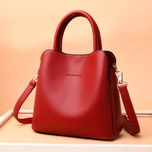 Red lychee grain leather handbag with CLASSIC lettering and golden hardware accessories