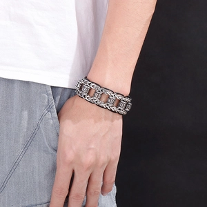 Detail of silver woven leather dragon chain bracelet for men in punk titanium steel style