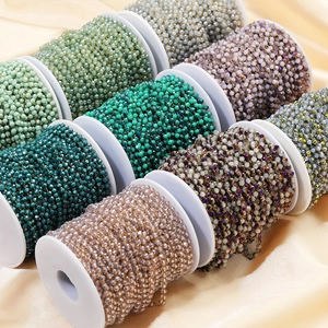 Multi-color 3.5mm crystal bead chains for DIY jewelry making on spools over beige fabric