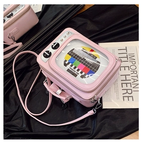 Close-up of pink retro TV shaped crossbody bag with transparent NO SIGNAL window