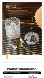 Detail of honeycomb glass candy jar with gold leaf spoon and colorful sweets inside