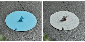 Blue whale and grey bear silicone drain covers showing animal handle details and texture