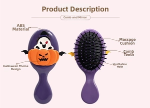 Detail view of purple Halloween pumpkin massage hairbrush with bat wings and ghost decor