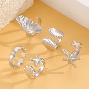 Detailed set of 5 silver ocean themed adjustable rings featuring starfish and seashells