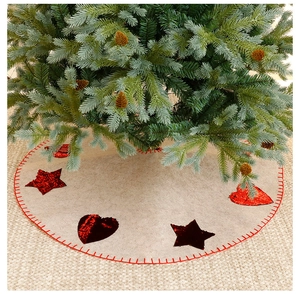 Detail of a 120cm Christmas tree skirt with red sequin stars and hearts on felt fabric