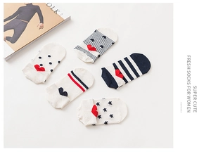 Flat lay of five women's cotton boat socks with heart-shaped heel, stripes and polka dots