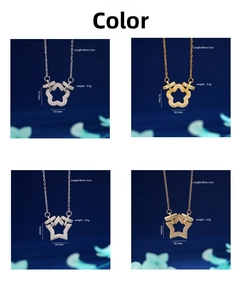 Detail of 18K gold plated flower and star pendants with pave cubic zirconia settings