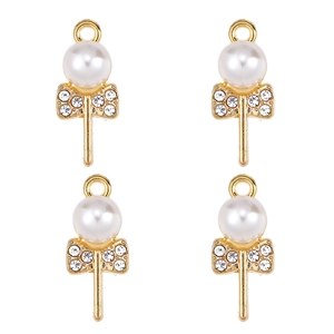 Macro detail of four gold lollipop pendants with white pearls and sparkling rhinestones