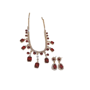 Elegant gold jewelry set featuring red square stones and crystal fringe tassels