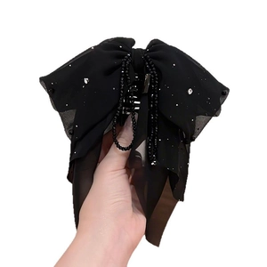 Elegant black oversized chiffon bow hair claw with sparkling sequins and beaded tassels